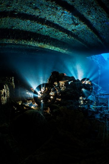 A BSA M20 military motorbike backlight with strobes on the upper level of Hold 2 of the wreck of the SS Thistlegorm. Sha'ab Ali, Red Sea. Sinai, Egypt.